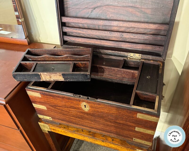 IMPRESSIVE CAMPAIGN STYLE ROSEWOOD BOX ON TABLE WITH CASTORS...$449.00