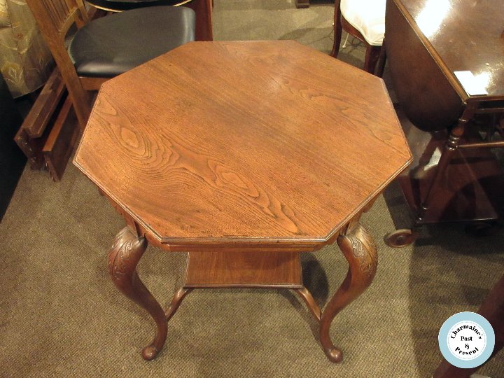 BEAUTIFUL OAK AND CARVED LEGS OCTAGONAL TABLE...$149.00.